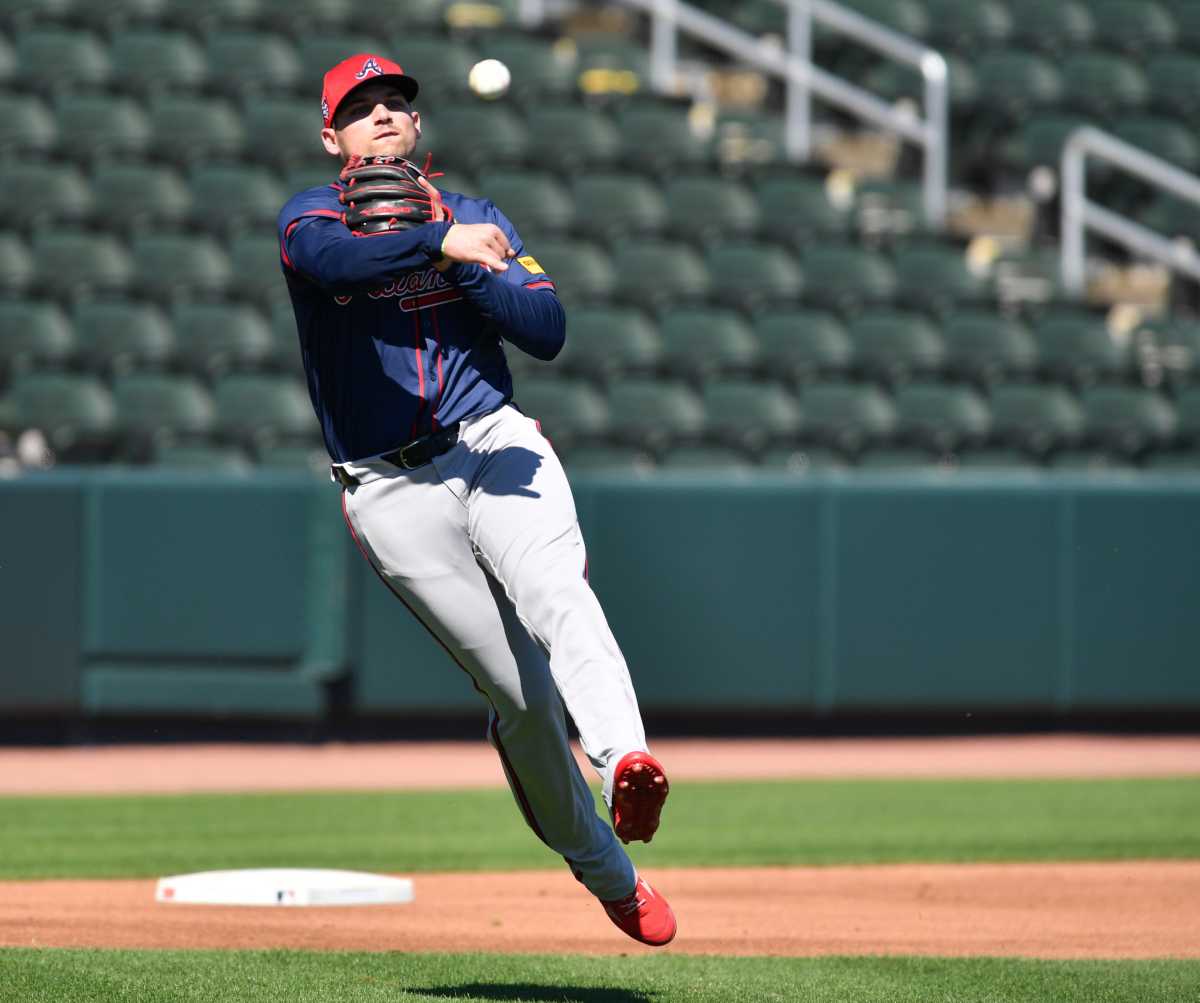 Atlanta Braves infielder Austin Riley (#27) throws to first base during a fielding drill Tuesday, Feb. 20, 2024 at CoolToday Park in North Port, Florida.  